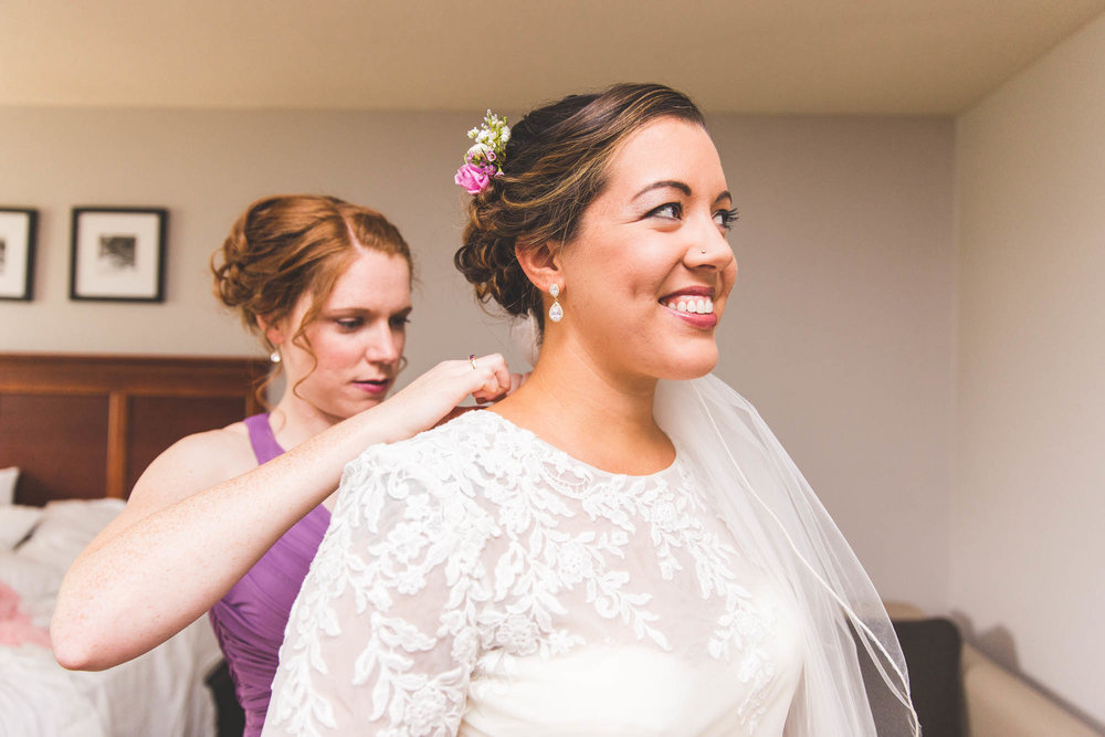 maid of honor buttoning bride dress ohio wedding