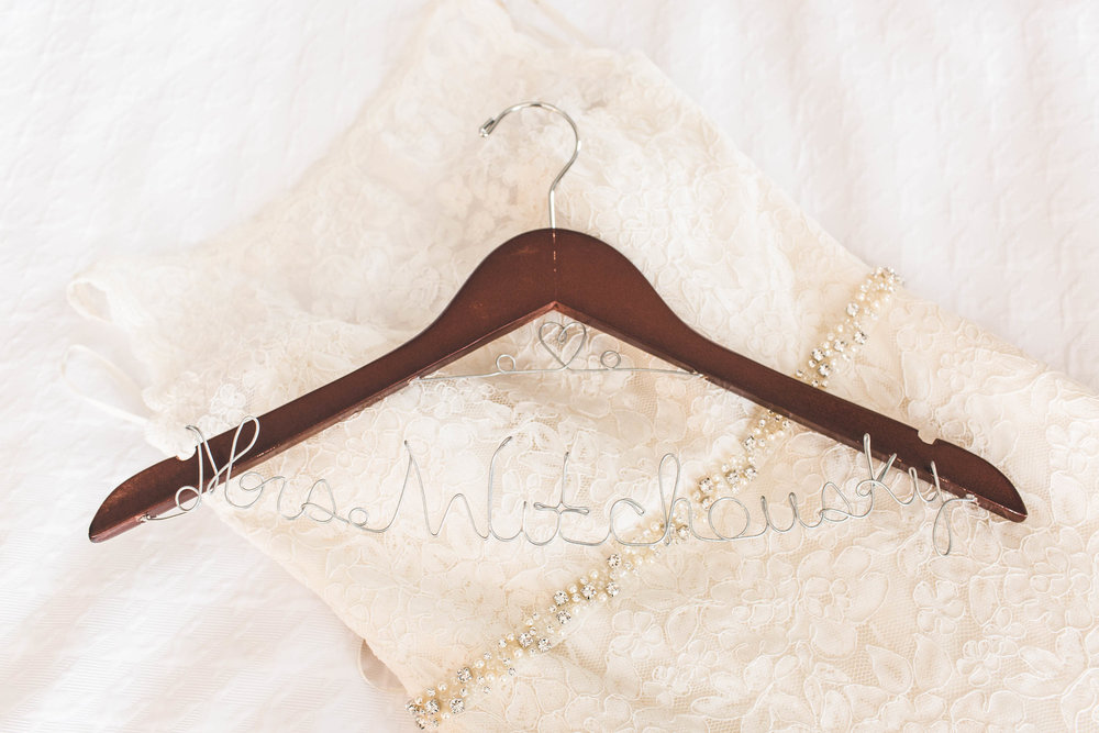 wedding dress and hanger with last name