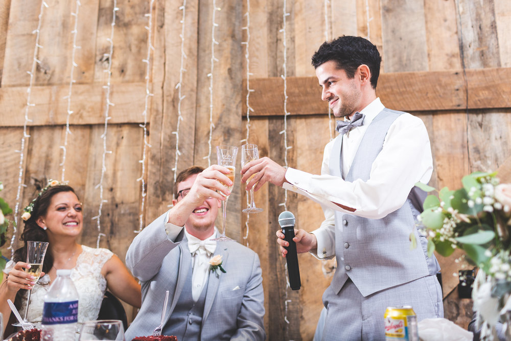 best man toasts the bride and groom