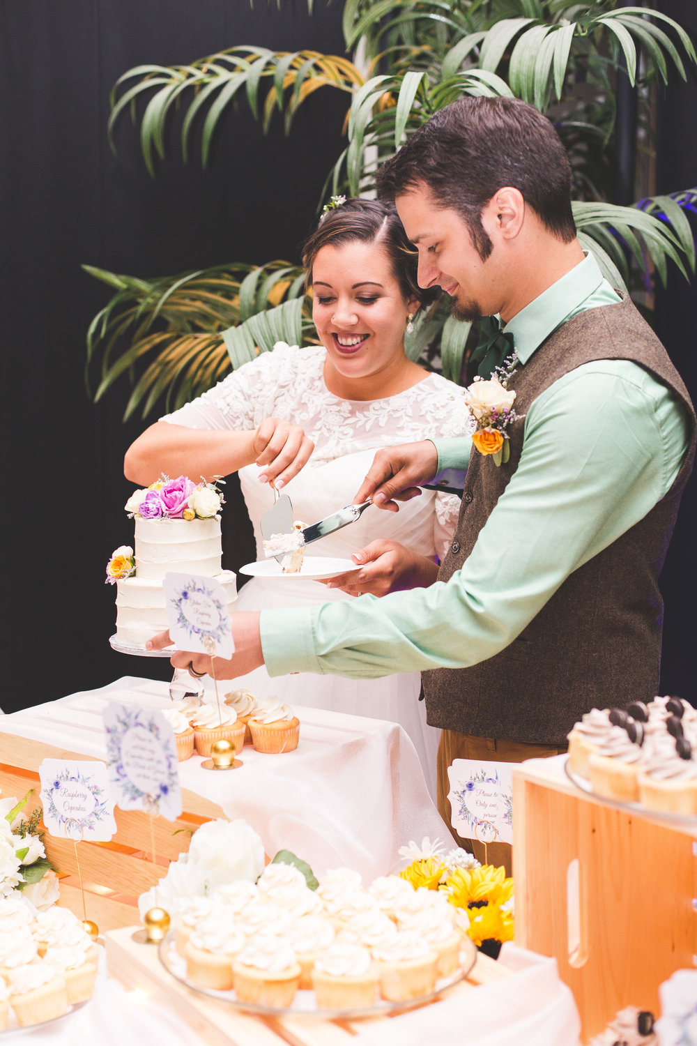 Bride and Groom cutting cake 