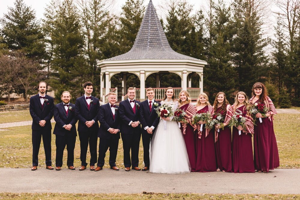 bridal party posing by gazebo at boardman park in youngstown ohio for wedding photography