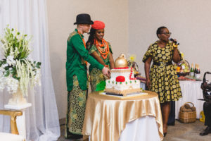 nigerian bride and groom cut cake on wedding day in columbus ohio