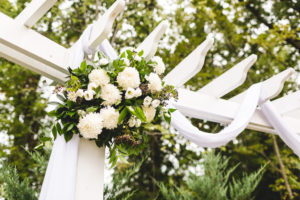 bloomtastic florals on arbor for outdoor wedding ceremony ohio