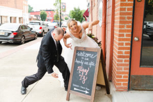 bride and groom laughing with wedding day sign wedding photography in circleville ohio