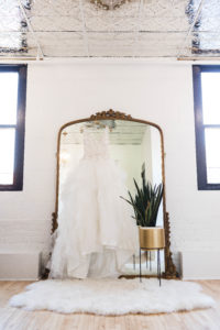 dress hanging from mirror in bridal suite photographer in ohio