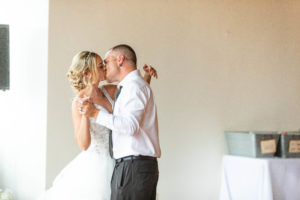 bride and groom kiss during first dance wedding photography in circleville ohio