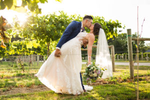 sam and grace photography winery wedding bride and groom grapes