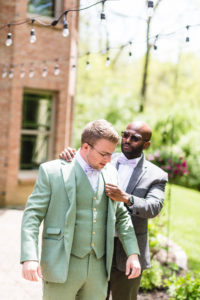 sage suit on groom