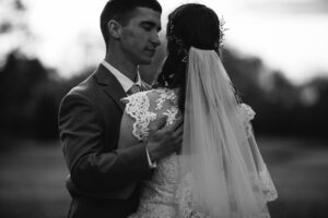 A bride and groom hold each other during sunset at brookside country club in ohio