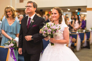 bride and father walking down the aisle