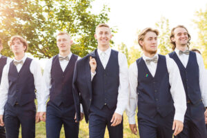 groomsmen walking into the camera during sunset outside in hilliard ohio