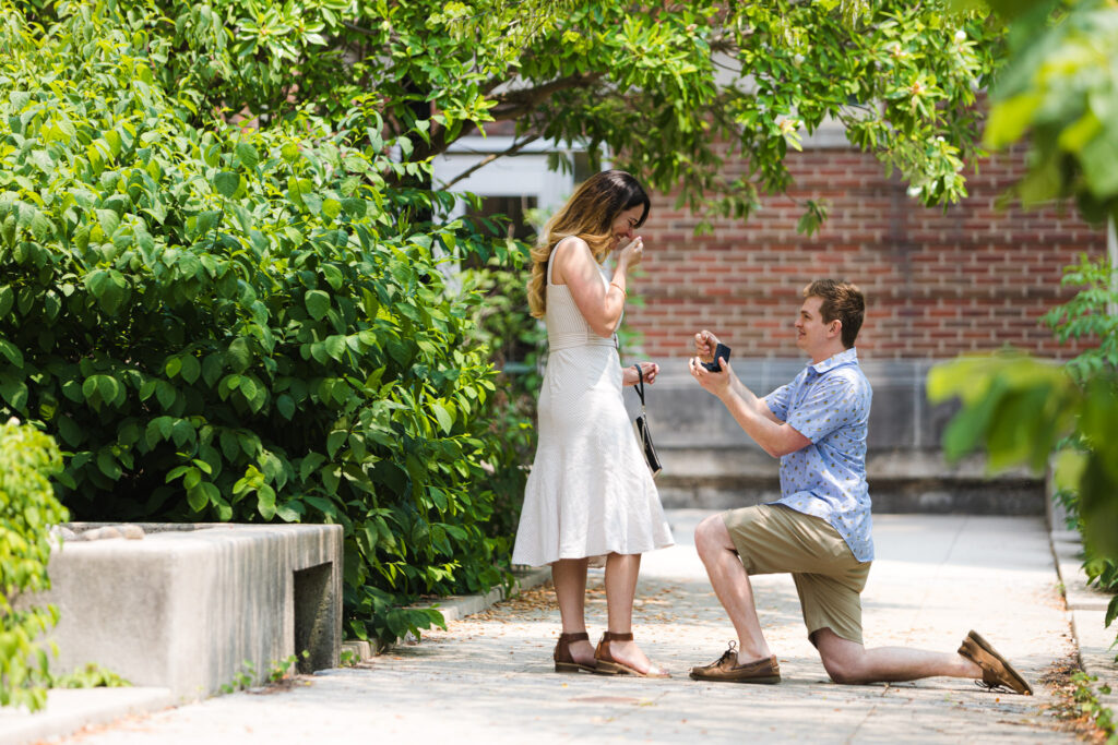 man proposes to woman in spring garden at OSU