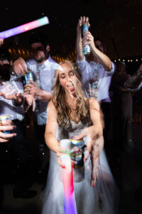 bride pops beer at wedding