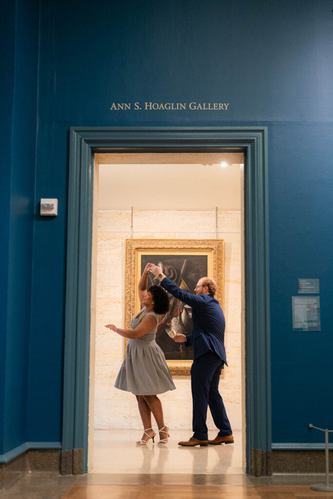 twirling in the doorway of the art museum by sam and grace photography