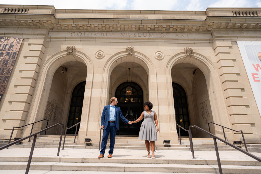 outside of the columbus art museum makes for the cutest engagement photos by sam and grace photography