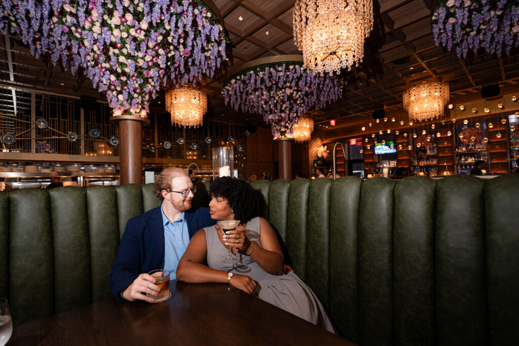 cutest engagement photos of couple relaxing at butcher and rose by sam and grace photography