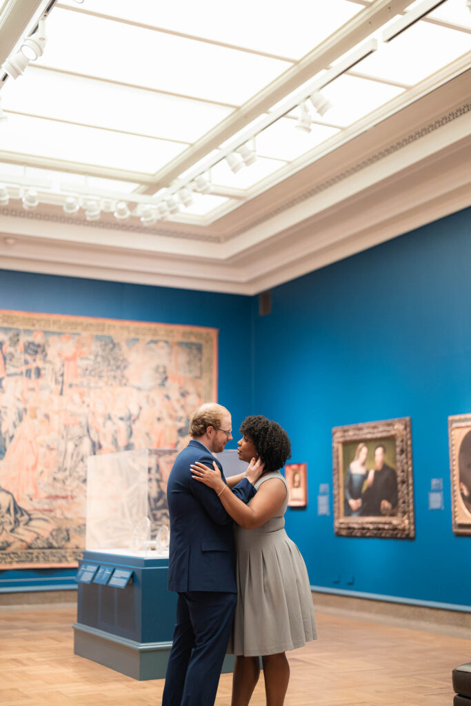 chic couple kisses during engagement session with sam and grace photography