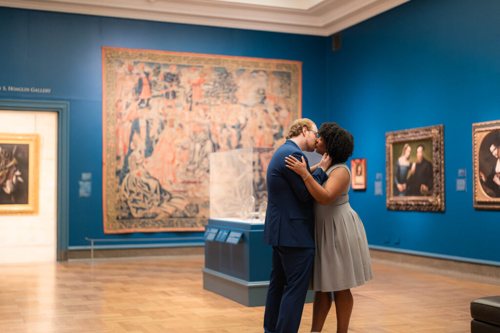 sam and grace photography captures kissing couple at art museum in columbus